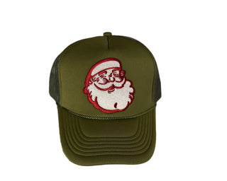 Green cap with a Santa Claus patch on a textured white background