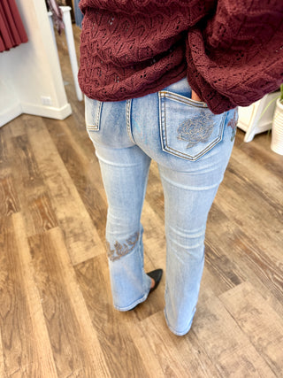 Untamed Rose Bootcut Jeans with floral embroidery and washed denim